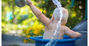 toddler playing with water