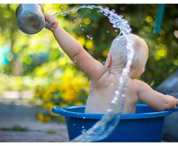toddler playing with water